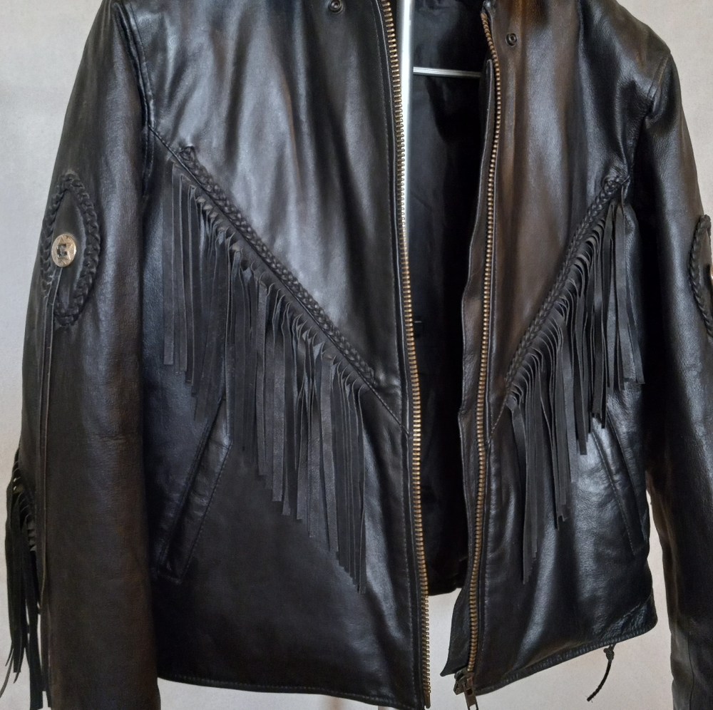 Black leather fringe coat. good condition does not have zip in lining. Unbranded